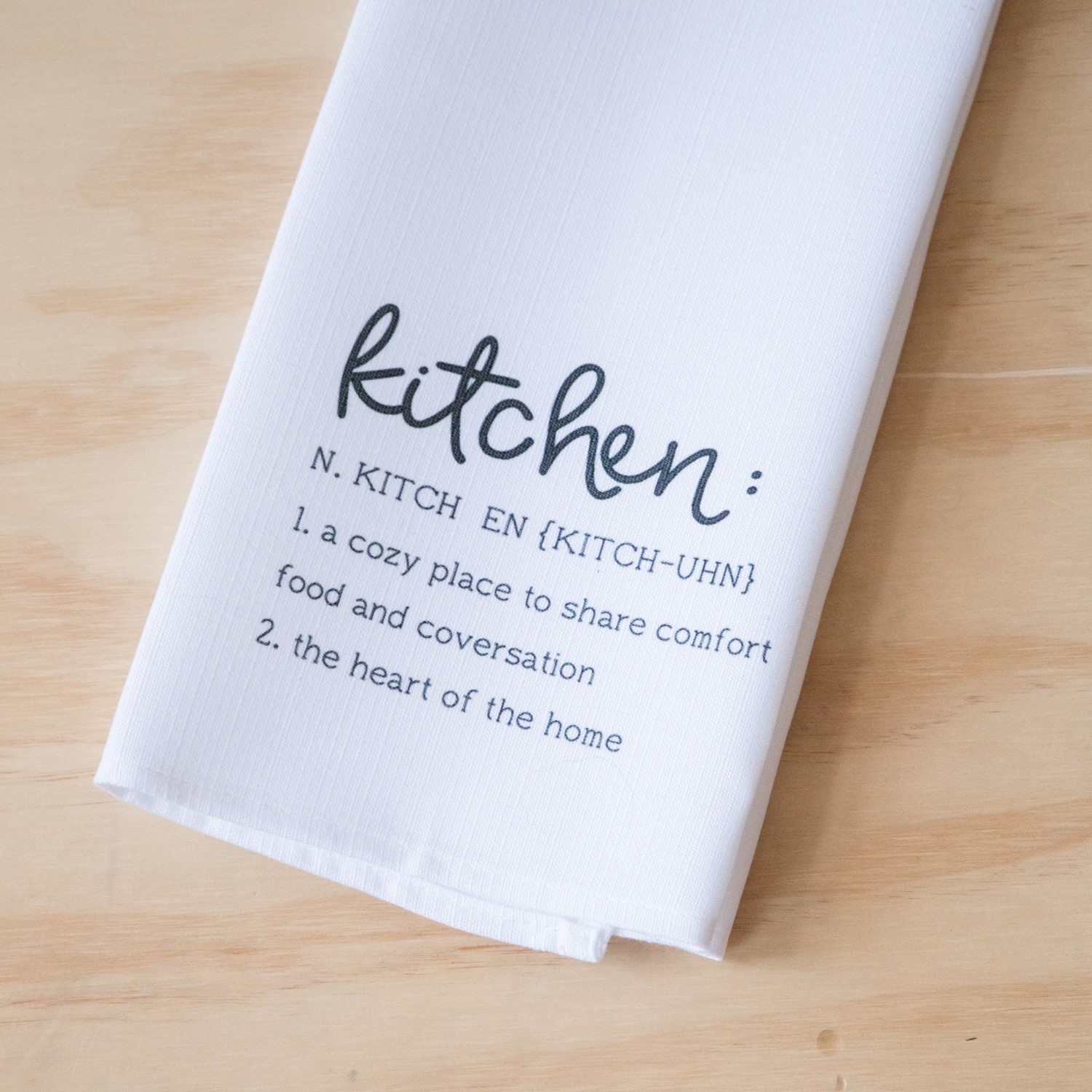 Kitchen towels with store sayings on them